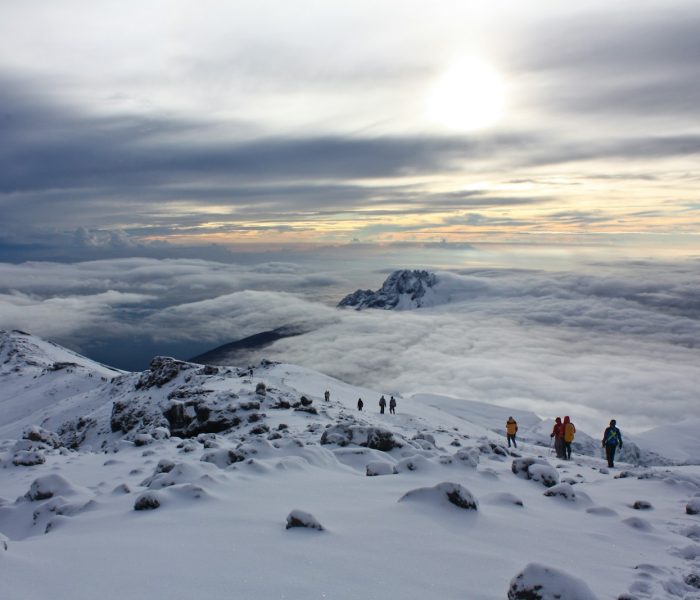 people on snow covered mountain during daytime